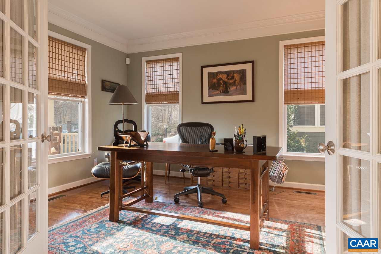 806 Village Road Charlottesville, VA 22903 - Photo 5 of 20 a workspace with furniture and a window