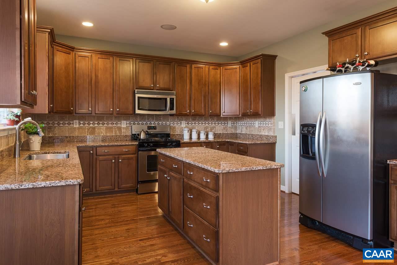 806 Village Road Charlottesville, VA 22903 - Photo 9 of 20 a kitchen with a refrigerator sink and microwave