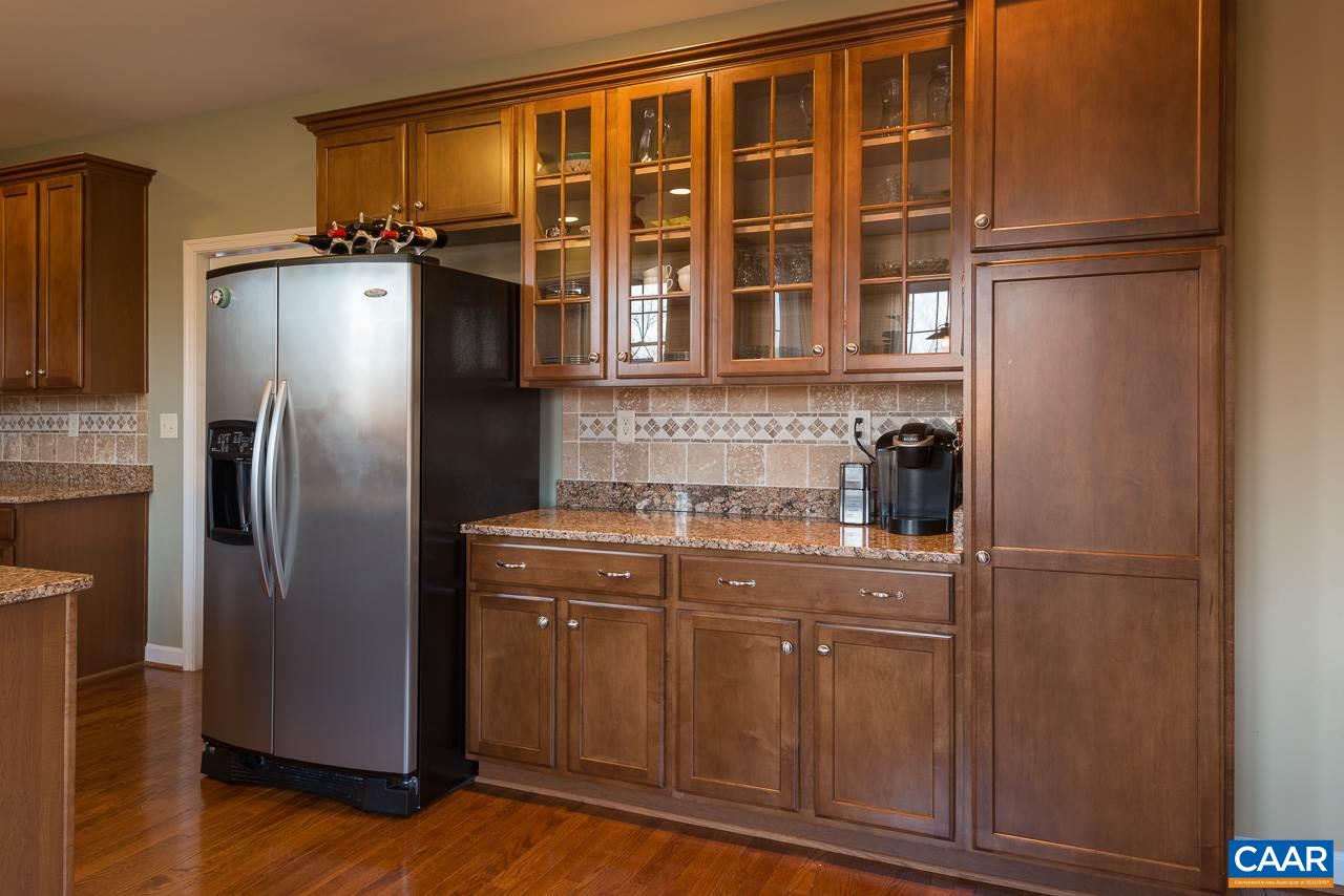 806 Village Road Charlottesville, VA 22903 - Photo 10 of 20 a kitchen with stainless steel appliances granite countertop a refrigerator and a sink