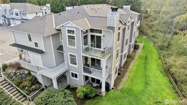 a aerial view of a house with a yard