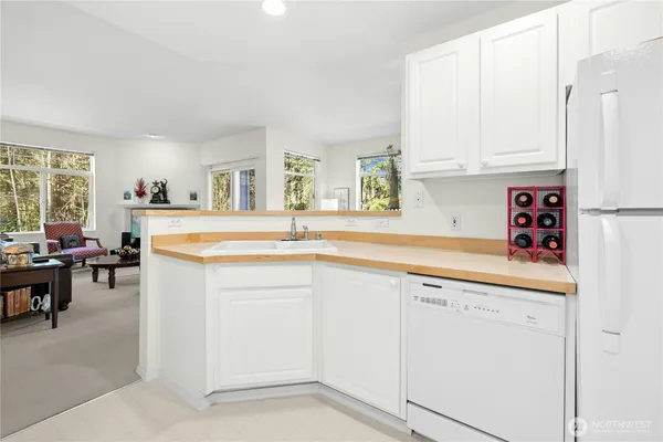 a kitchen with cabinets and window