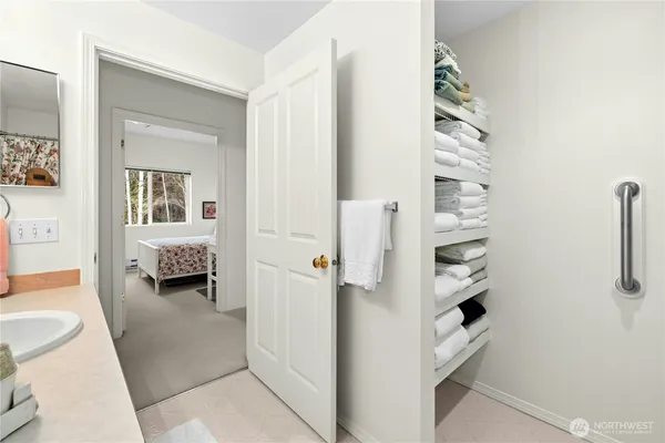 a bathroom with a double vanity sink mirror and toilet
