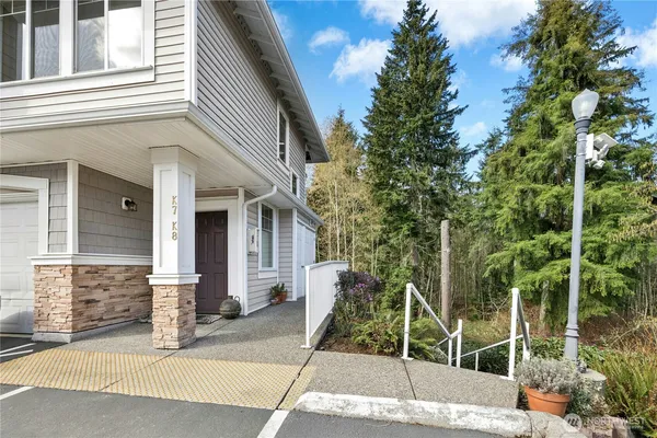 a house with a tree in front of it