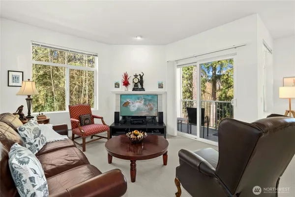 a living room with furniture and a large window