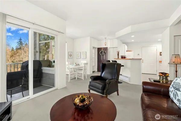 a living room with furniture and a table