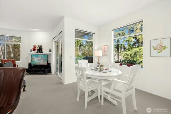 a view of a dining room with furniture window and outside view
