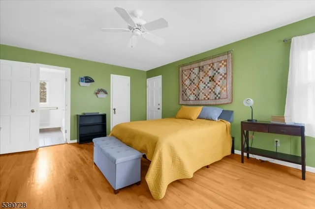 a bedroom with a bed and a table in it