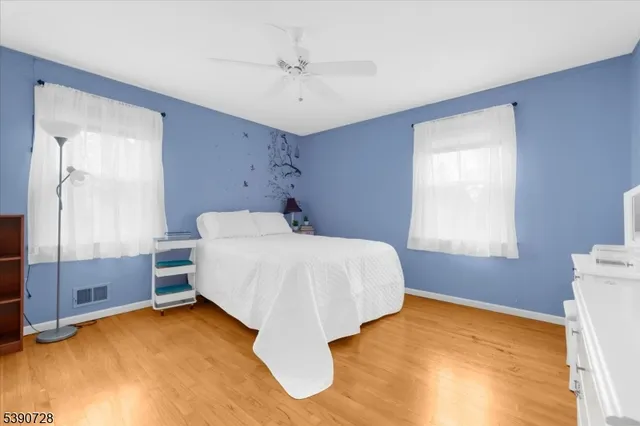 a bed room with a bed and a window