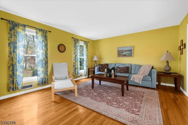 a living room with furniture and a table