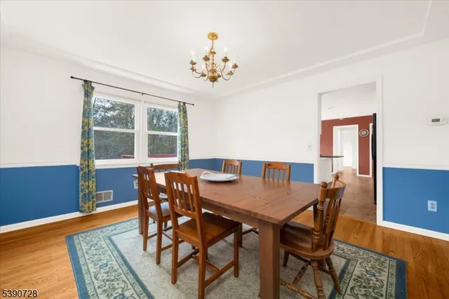 a view of a dining room with furniture and window