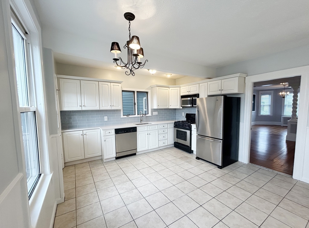 80 Linden Street, Unit 80 Salem, MA 01970 - Photo 11 of 35 a kitchen with stainless steel appliances a refrigerator sink and microwave