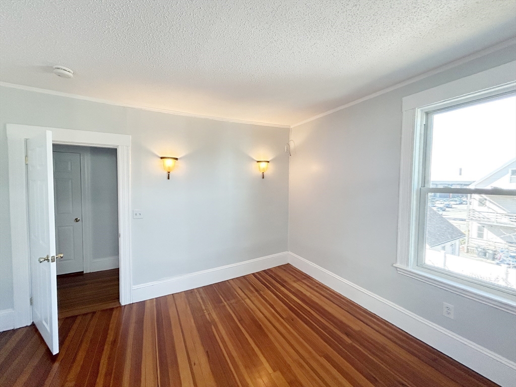 80 Linden Street, Unit 80 Salem, MA 01970 - Photo 16 of 35 a view of a room with wooden floor and window
