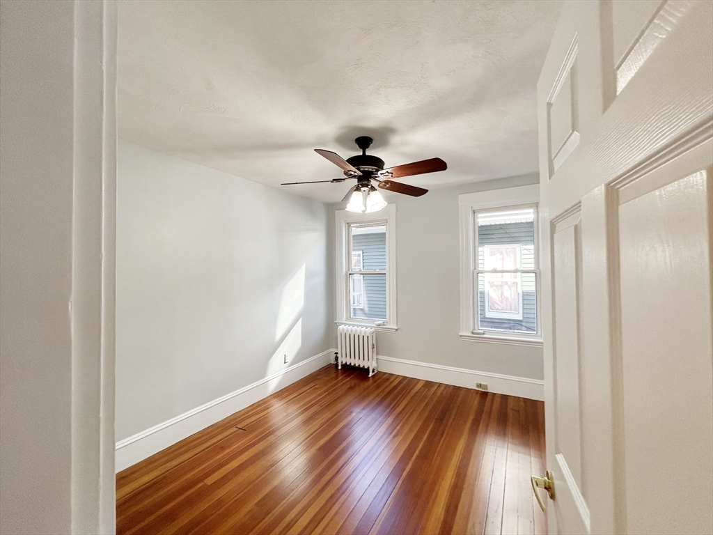 80 Linden Street, Unit 80 Salem, MA 01970 - Photo 20 of 35 wooden floor in an empty room with a window