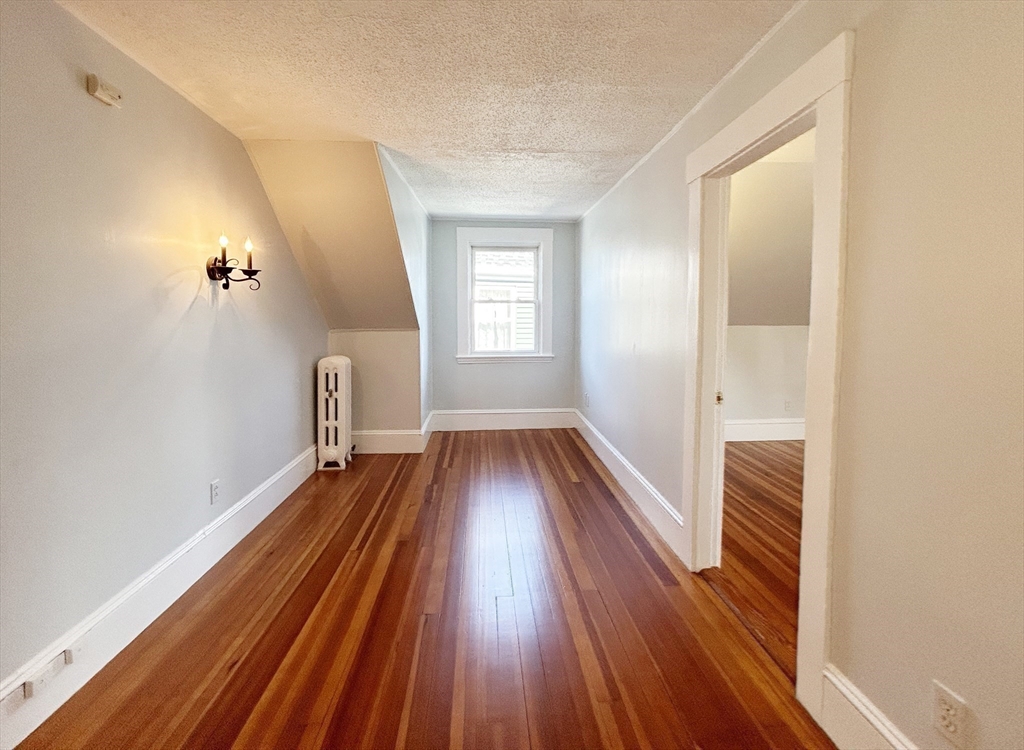 80 Linden Street, Unit 80 Salem, MA 01970 - Photo 29 of 35 a view of a room with wooden floor