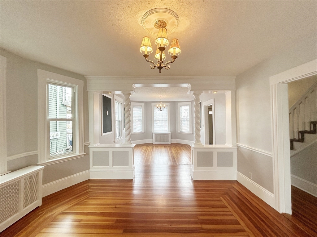 80 Linden Street, Unit 80 Salem, MA 01970 - Photo 5 of 35 wooden floor in an empty room with a window