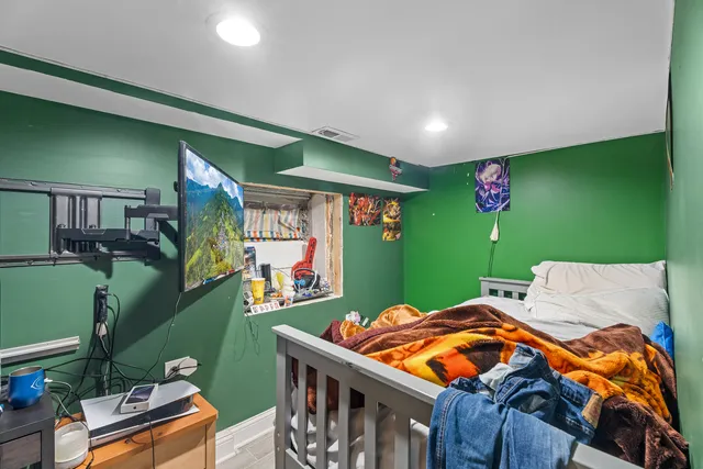 a bathroom with a toilet sink a mirror and vanity