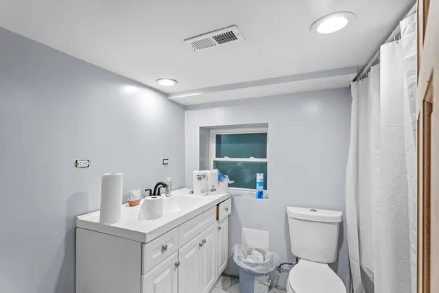 a living room with lots of furniture and a wooden floor