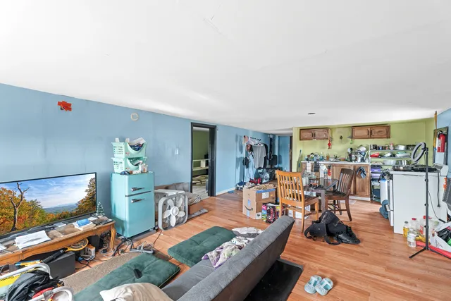 a bedroom with bed and a window