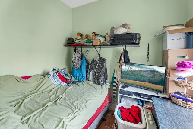 a white toilet sitting next to a bathroom sink and a tub