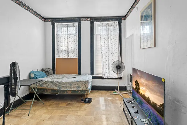 a bathroom with a sink a toilet a mirror a bathtub and shower