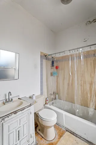 a bathroom with a tub and a sink