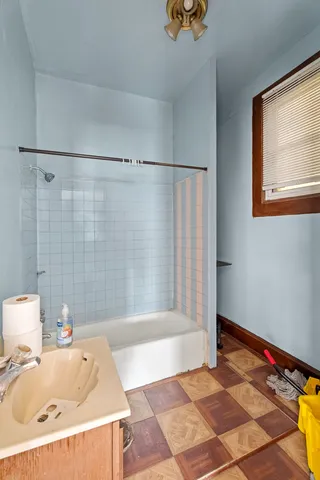 a living room with a couch and a dining table