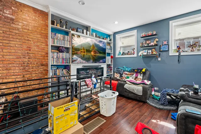 a kitchen with stainless steel appliances a stove a sink and a refrigerator