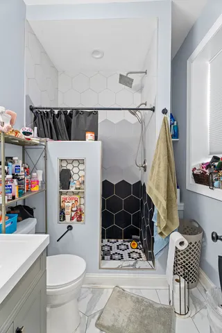 a bedroom with a bed and dresser