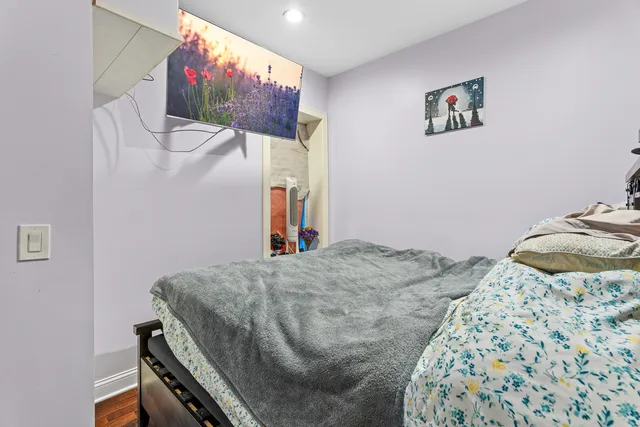 a bedroom with a bed and furniture