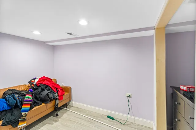 a bedroom with furniture and a swimming pool