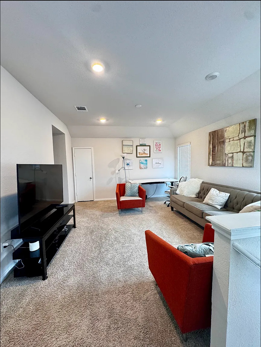 204 Brooklyn Drive Georgetown, TX 78626 - Photo 5 of 10 Spacious room featuring neutral carpeting, recessed lighting, and white walls