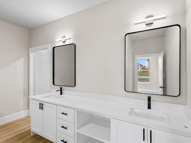 an empty room with a ceiling fan and a window