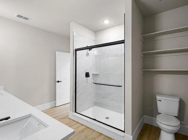 a bathroom with double vanity sink and a mirror