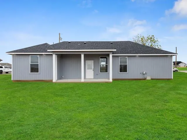 a backyard of a house with lots of green space