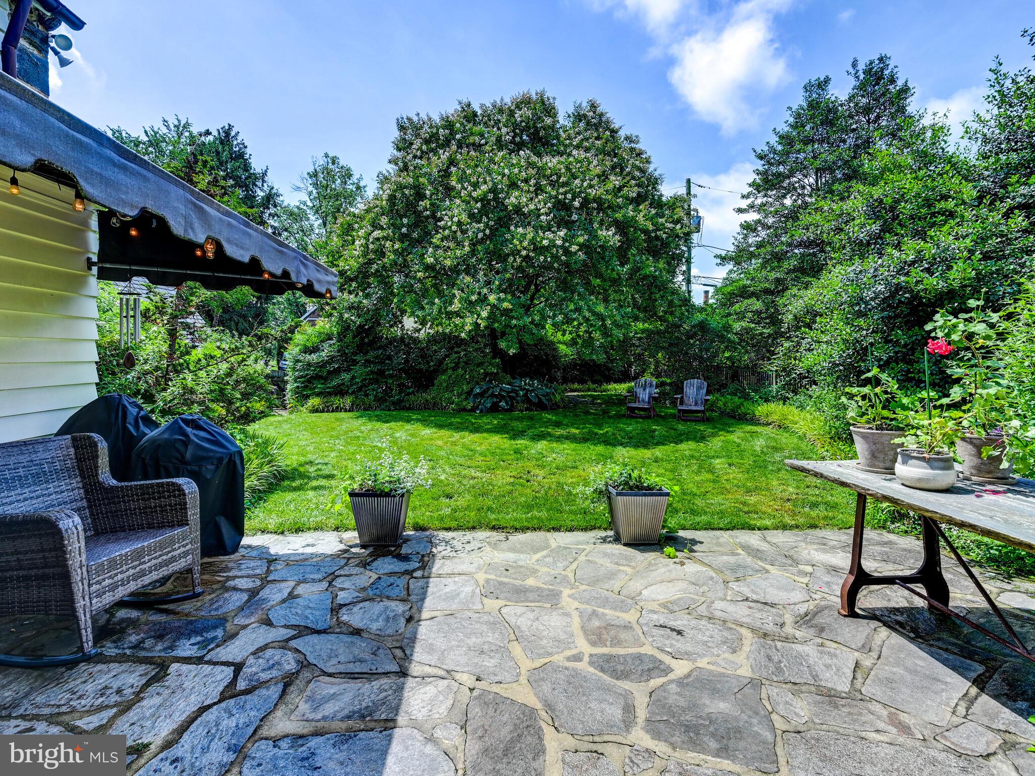 209 Paddington Road Baltimore, MD 21212 - Photo 13 of 36 a view of a table and chair in the garden