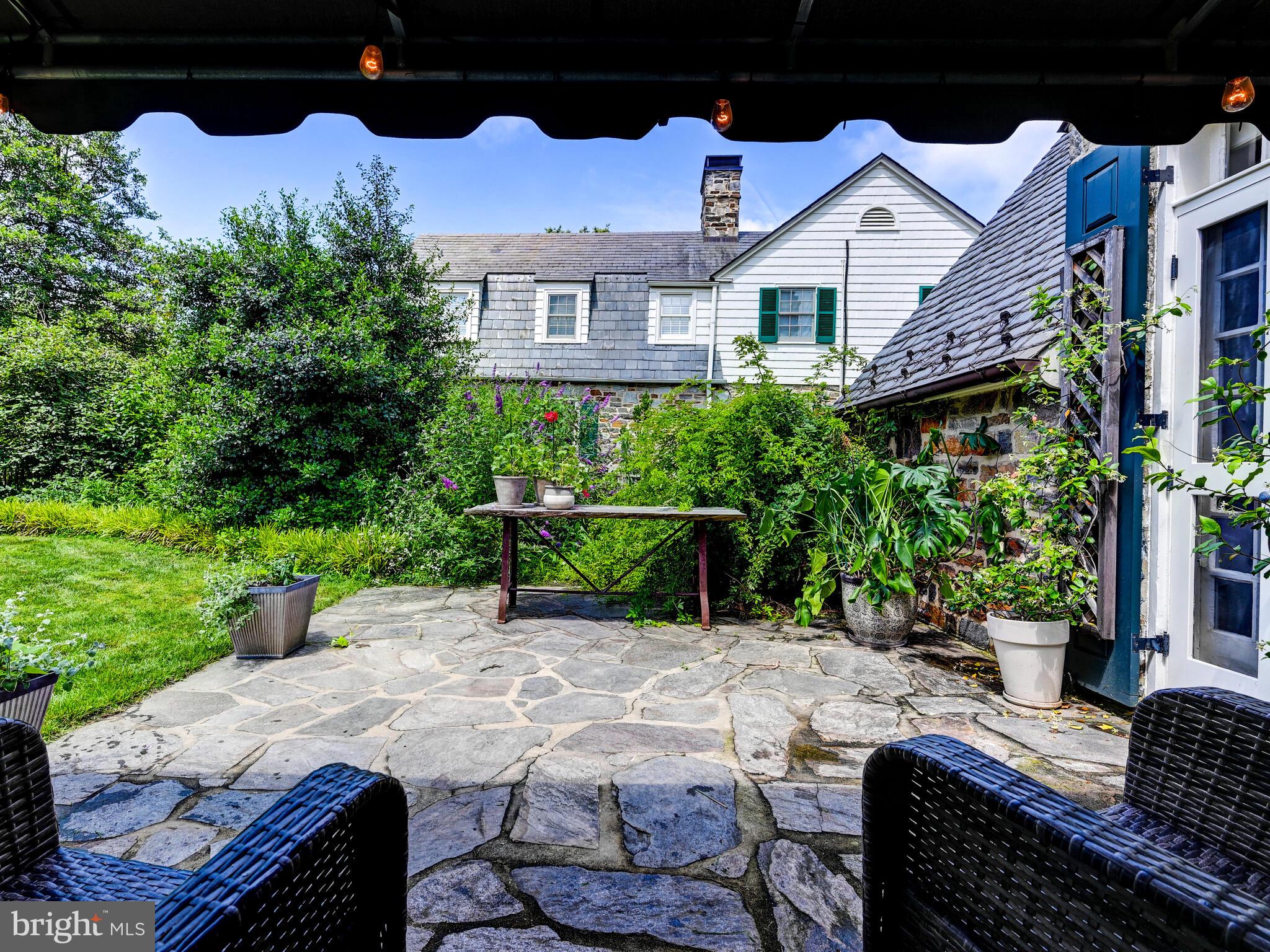 209 Paddington Road Baltimore, MD 21212 - Photo 14 of 36 a view of a patio with table and chairs and potted plants