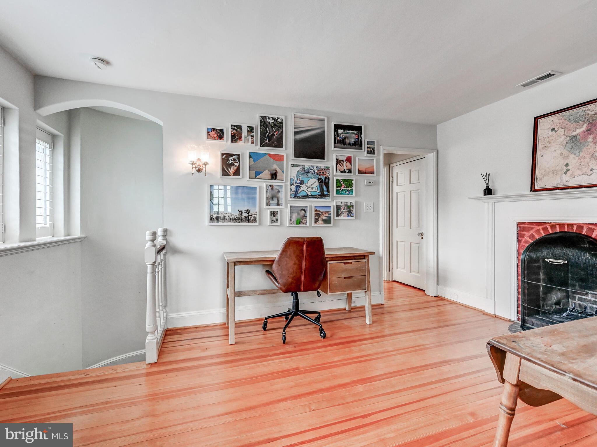 209 Paddington Road Baltimore, MD 21212 - Photo 22 of 36 a view of a workspace with furniture and wooden floor