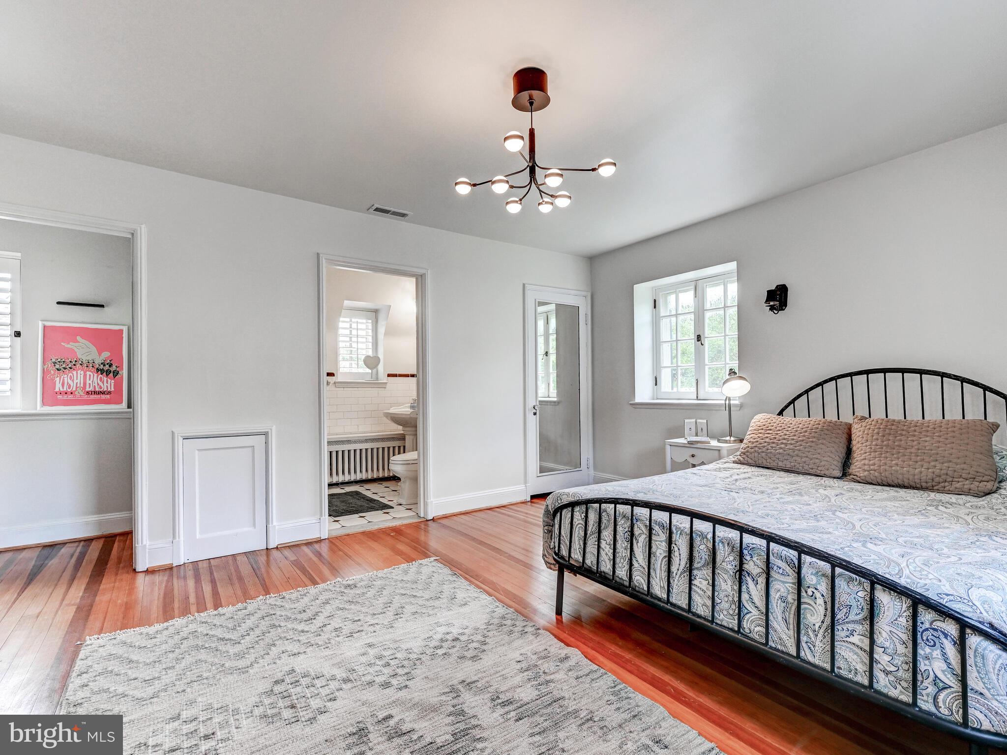 209 Paddington Road Baltimore, MD 21212 - Photo 23 of 36 a bedroom with a bed and a dresser in it