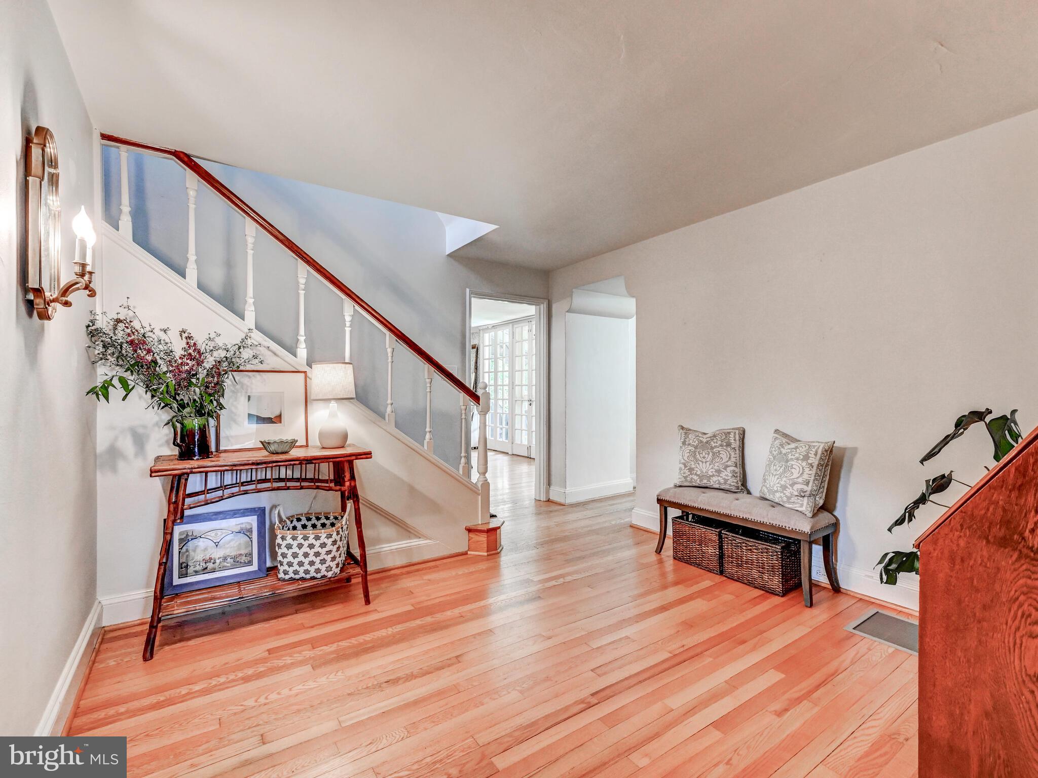 209 Paddington Road Baltimore, MD 21212 - Photo 5 of 36 a view of a room with wooden floor and stairs