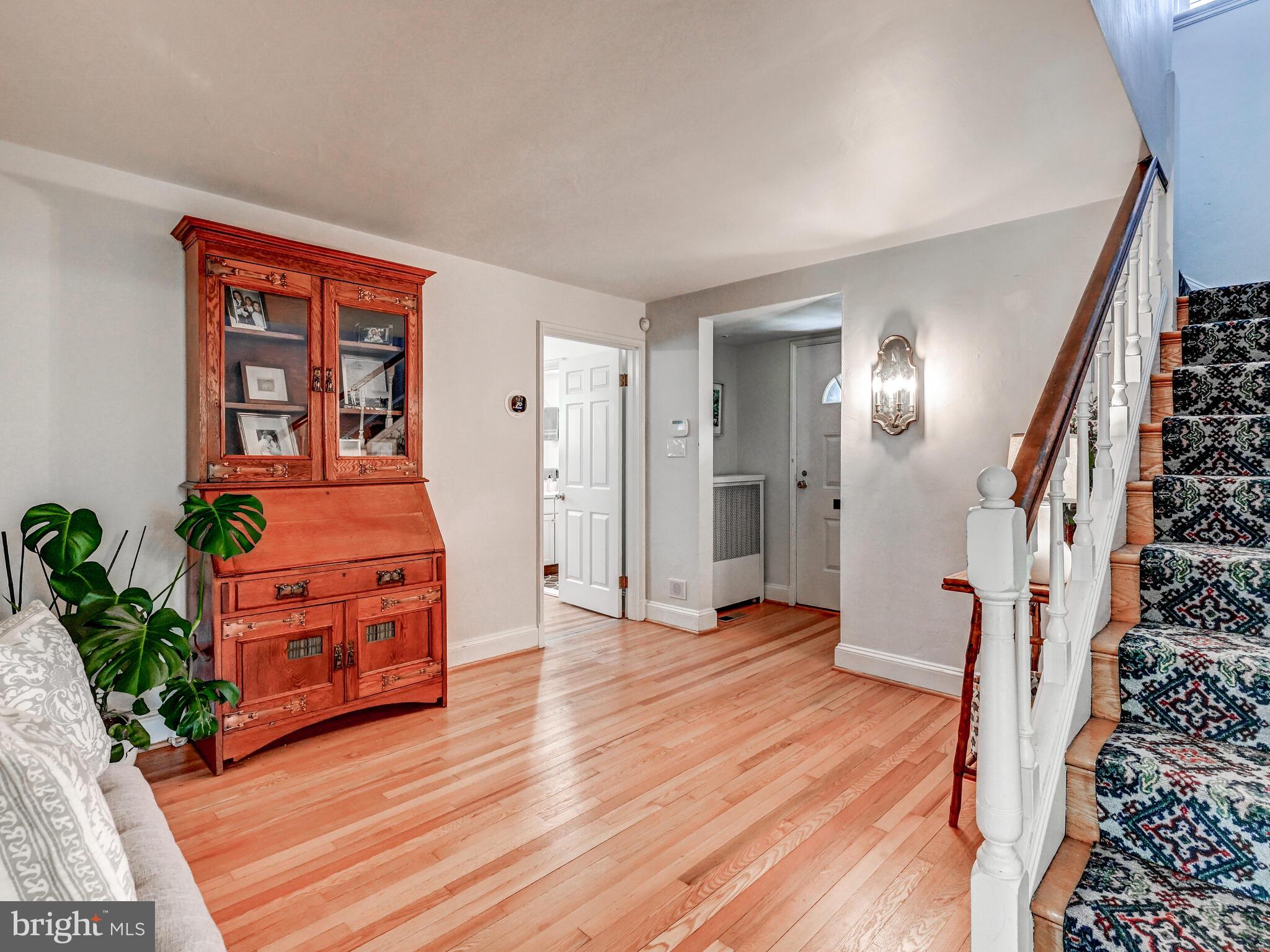 209 Paddington Road Baltimore, MD 21212 - Photo 6 of 36 a view of a bedroom with wooden floor and entryway