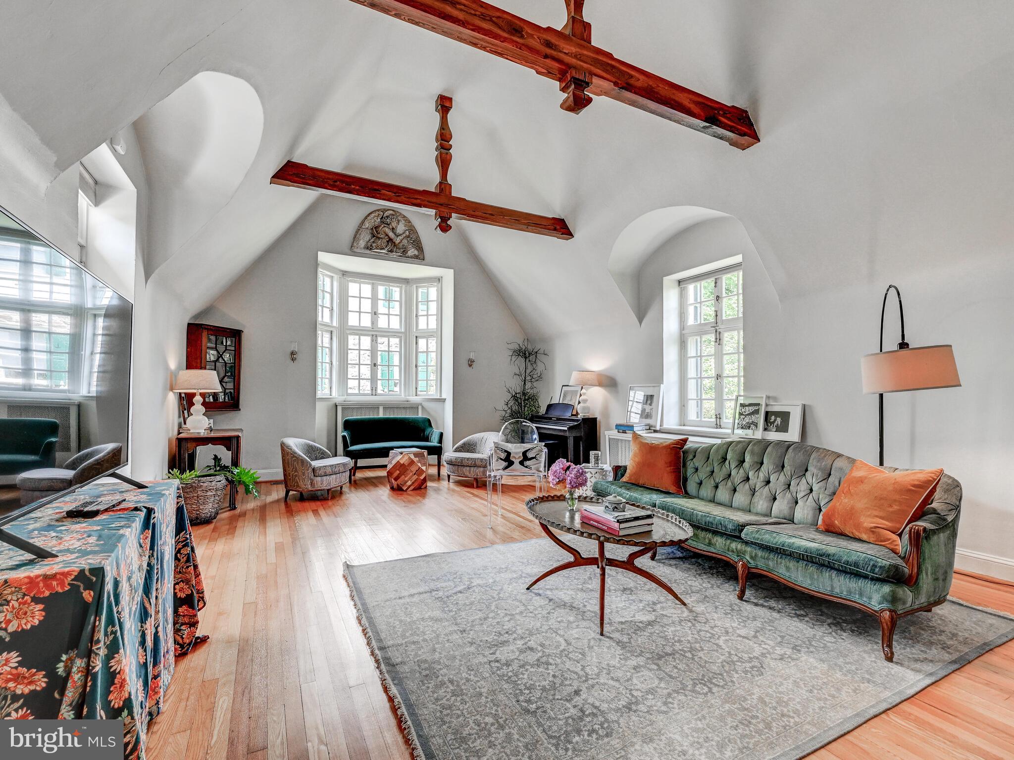 209 Paddington Road Baltimore, MD 21212 - Photo 7 of 36 a living room with furniture a window and a flat screen tv