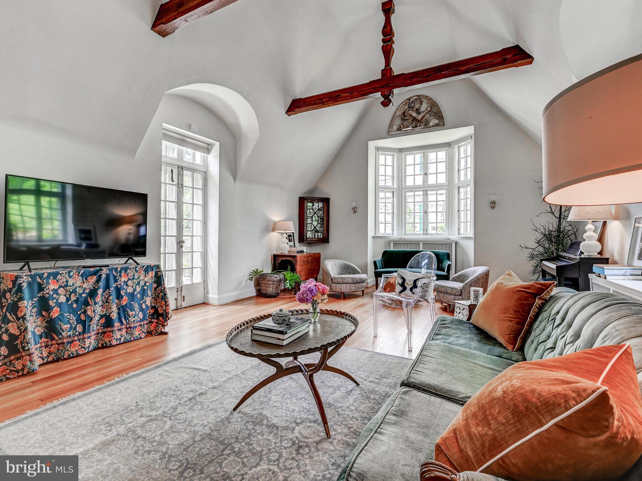 209 Paddington Road Baltimore, MD 21212 - Photo 8 of 36 a living room with furniture a flat screen tv and a window