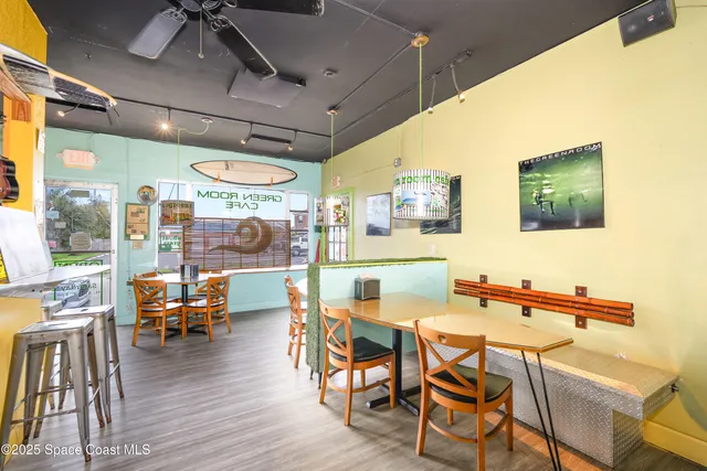 a view of a dining room with furniture wooden floor and a chandelier