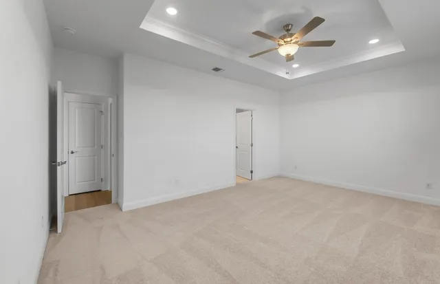 a view of an empty room with a kitchen