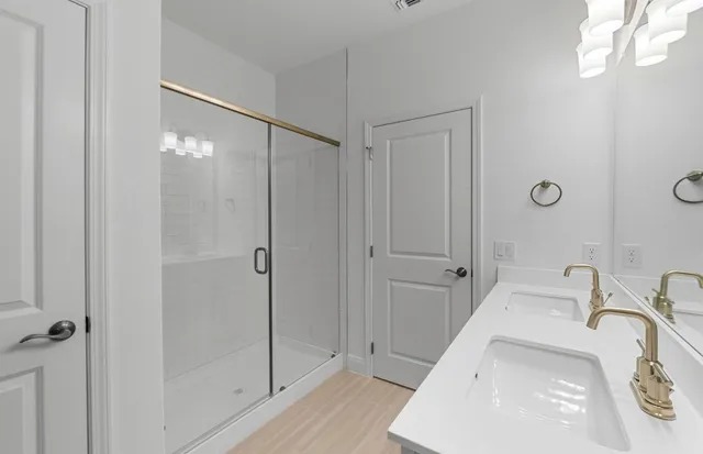 an empty room with window and ceiling fan