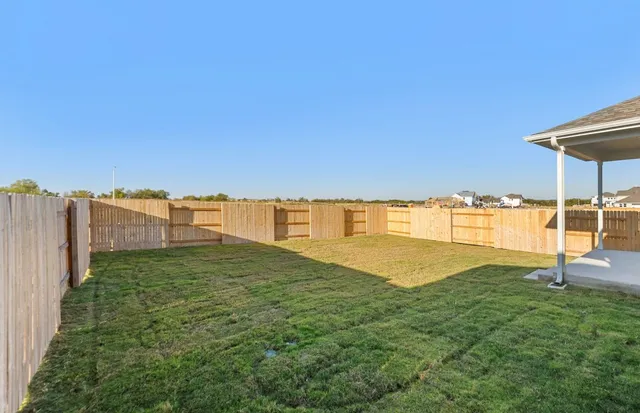 a bathroom with a sink a toilet and a large mirror