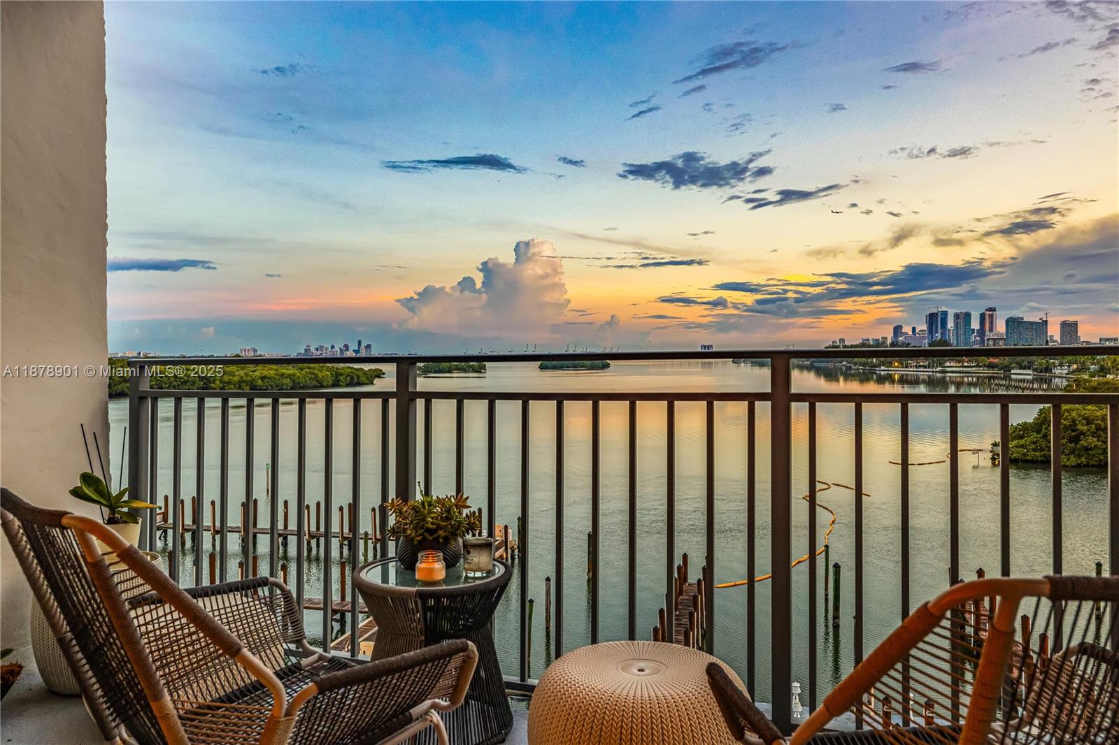 a view of a balcony with wooden chairs