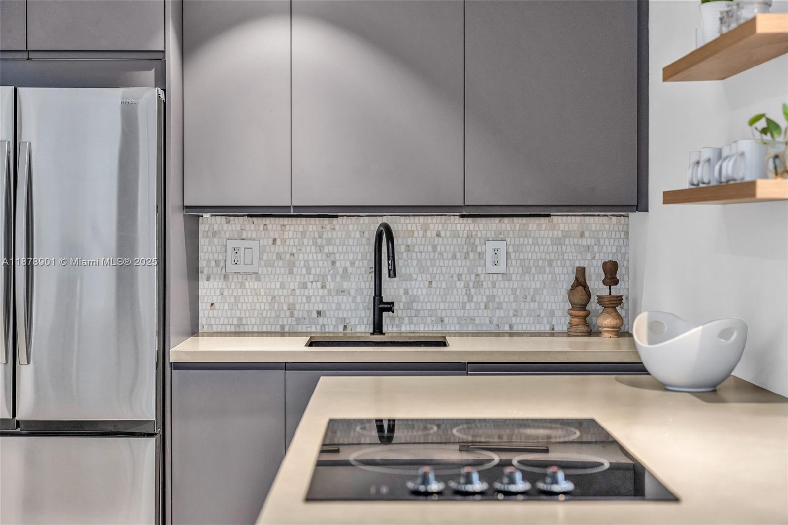 770 Northeast 69th Street, Unit 6H Miami, FL 33138 - Photo 12 of 71 a kitchen with a refrigerator and a sink