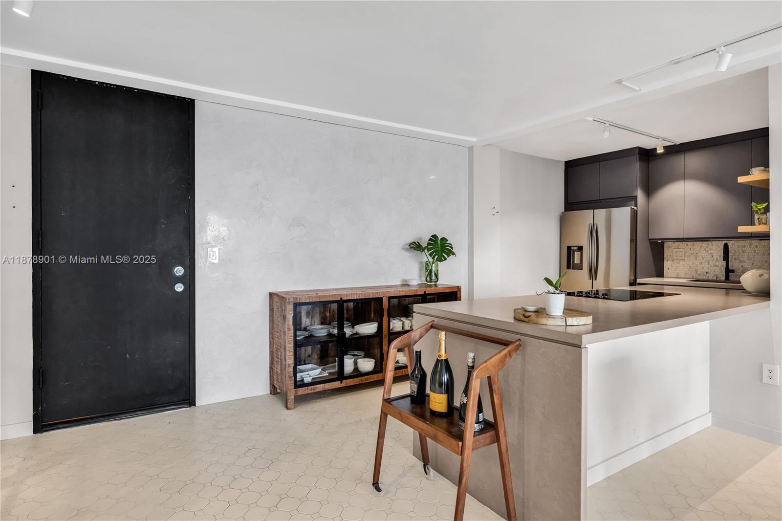 770 Northeast 69th Street, Unit 6H Miami, FL 33138 - Photo 14 of 71 a kitchen with stainless steel appliances granite countertop a sink and a refrigerator