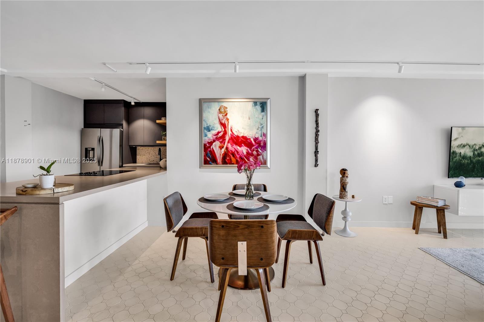 770 Northeast 69th Street, Unit 6H Miami, FL 33138 - Photo 16 of 71 a view of a dining room with furniture and chandelier
